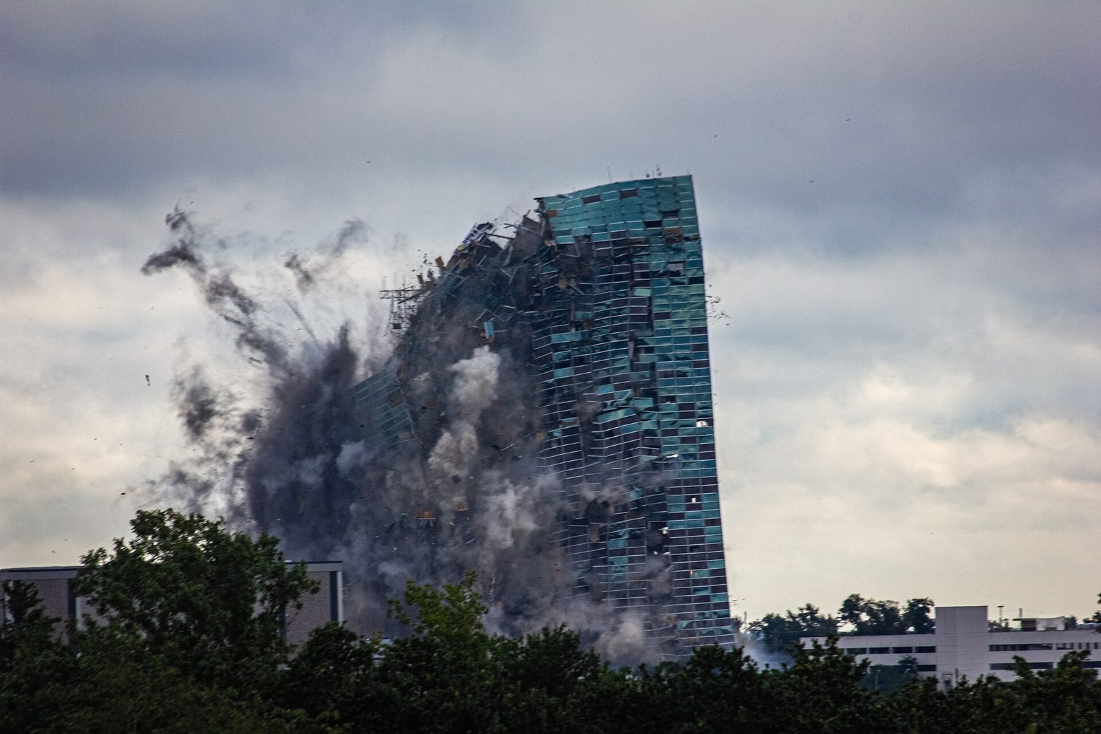 The former Capital One Tower in downtown Lake Charles collapsing in a cloud of dust during its implosion